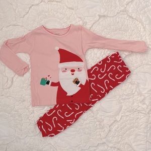 Santa having hot chocolate and Candy cane pajamas